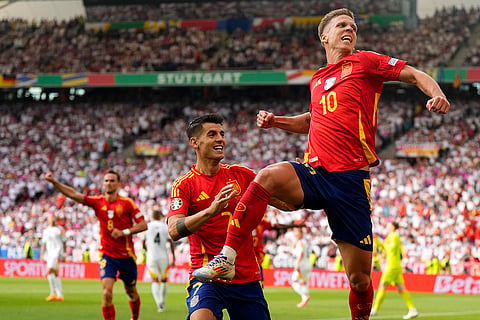 Dani Olmo celebrates scoring Spain's first goal 